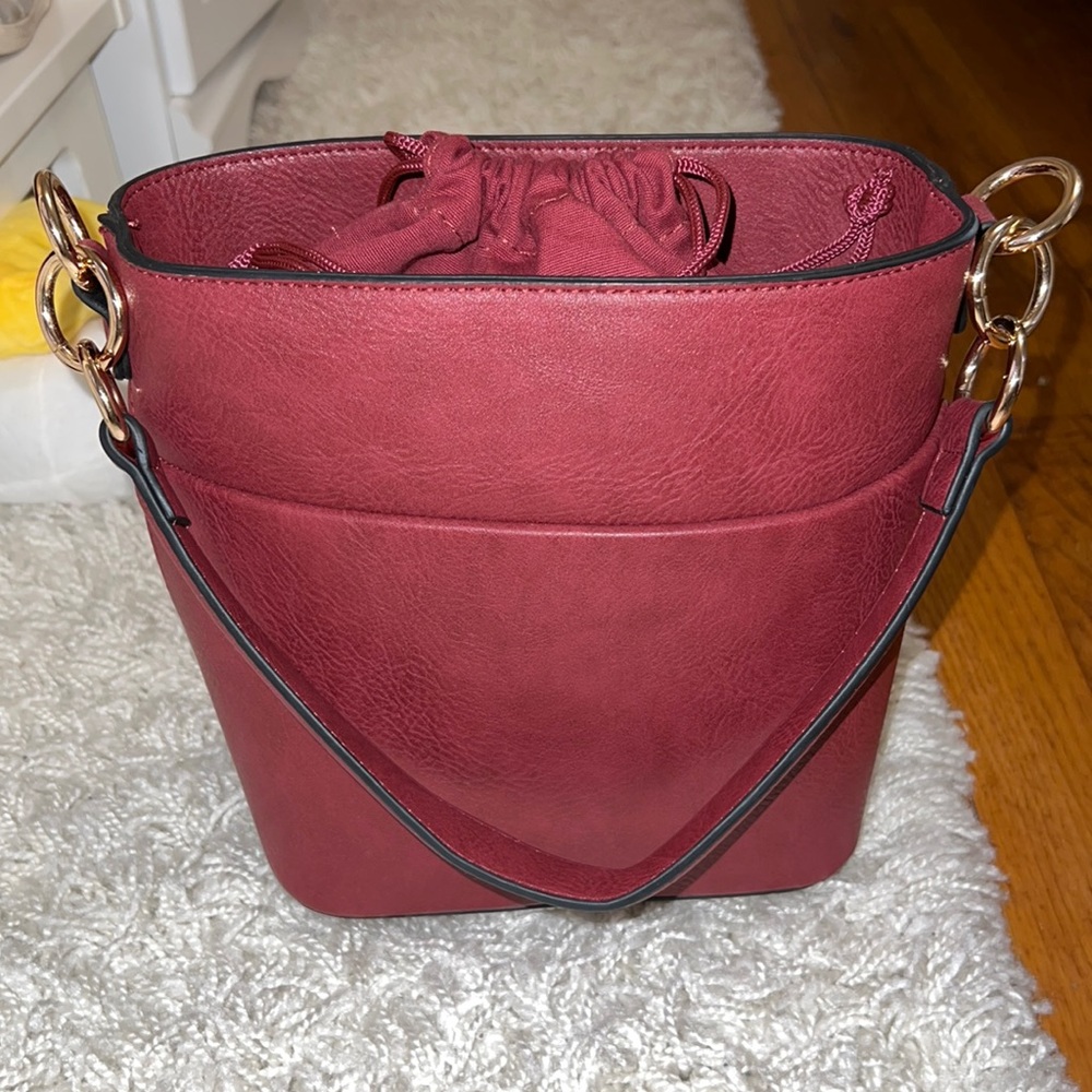 NWOT burgundy bag, unused in very good condition.